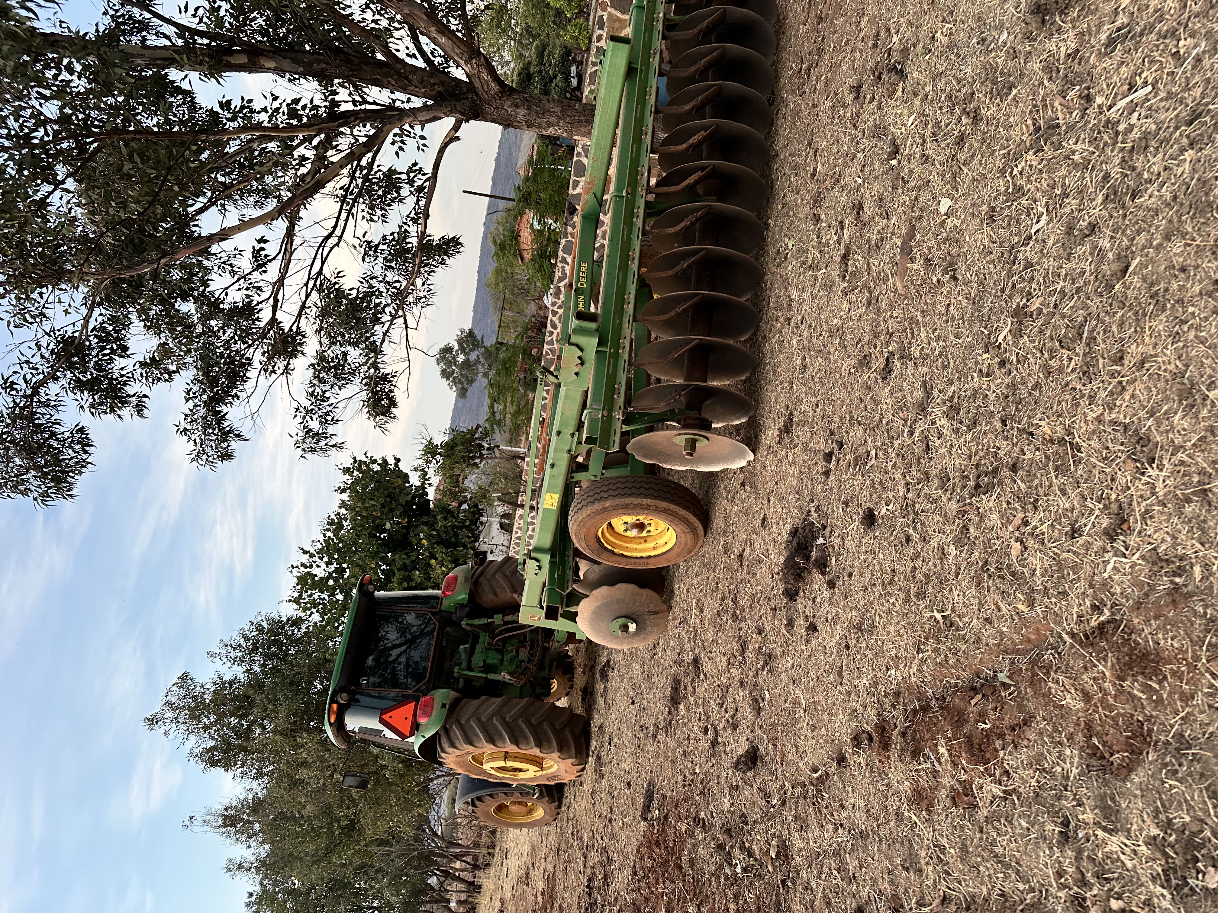 Tiger Tree Services tractor and ground equipment deployed at a large-scale tree removal and site clearance job in California