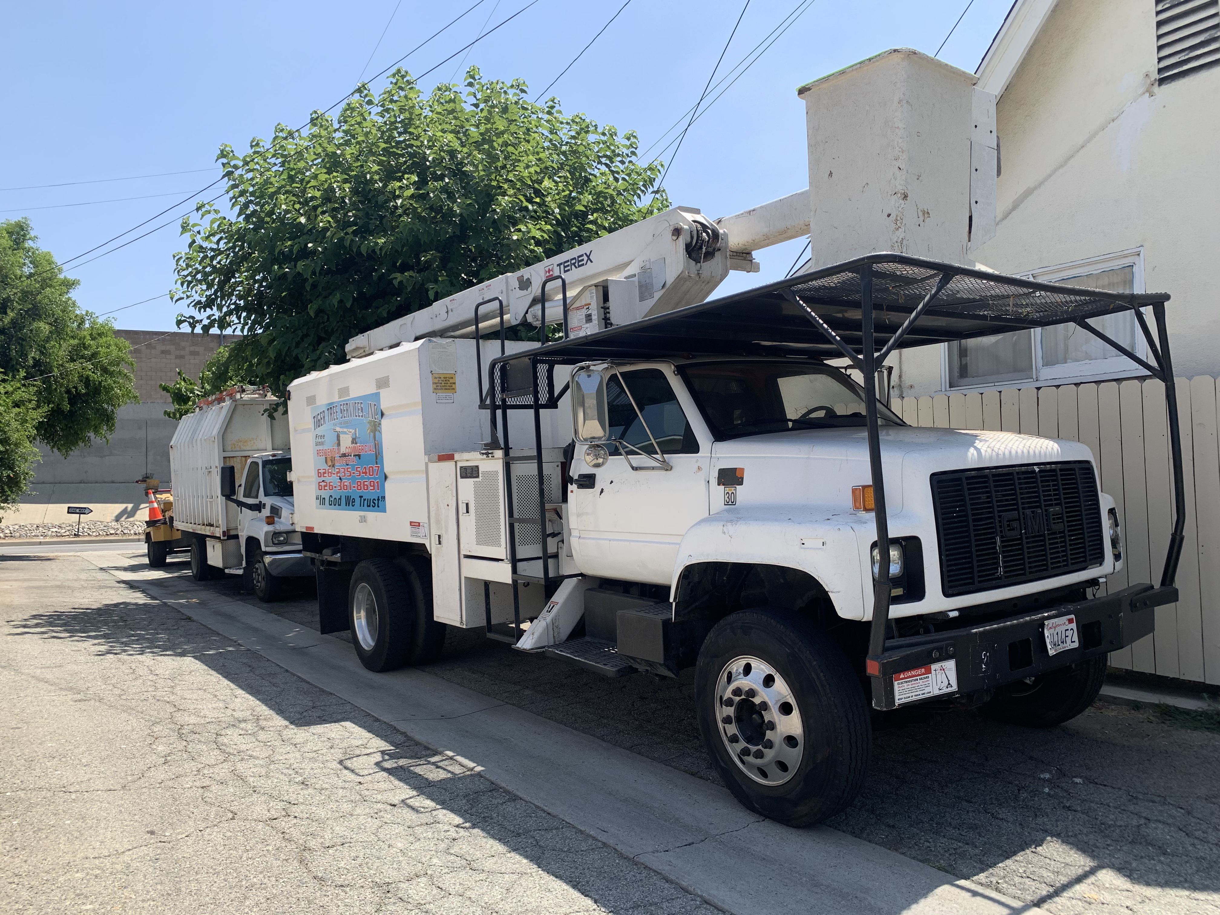 Tiger Tree Services crane and bucket truck