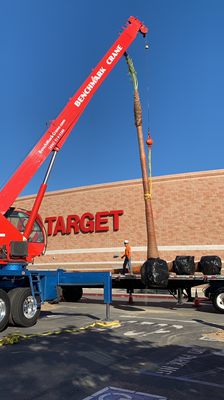 Benchmark Crane lifting a 45-foot palm tree for installation at a Target store in Southern California